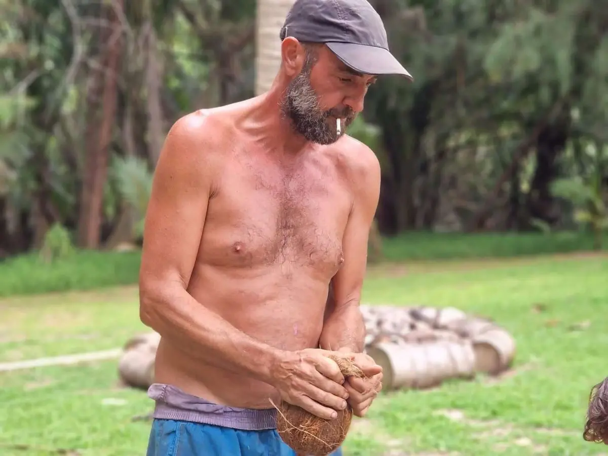 Mica shredding a coconut at his home plantage in Bora Bora