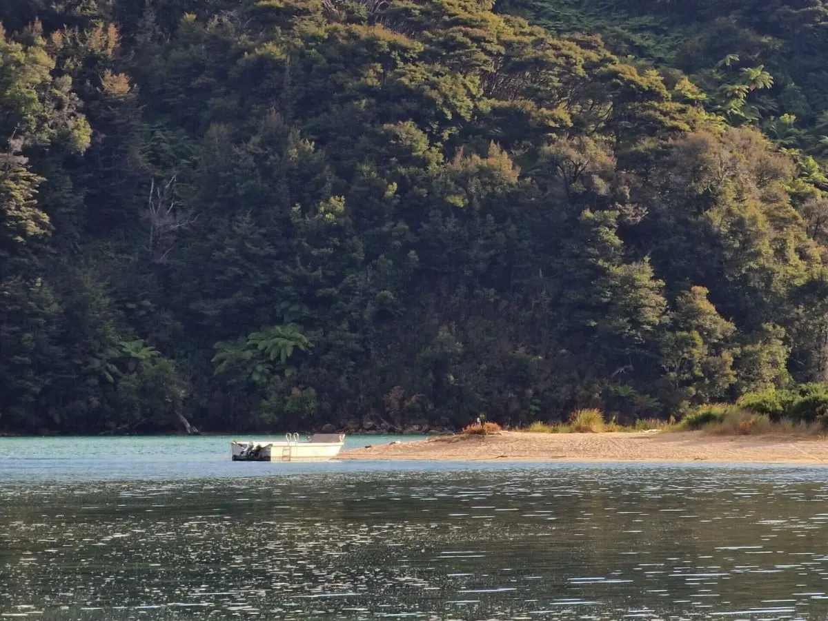 Crossing the Awaroa Inlet on the Abel Tasman Coast Track in New Zealand
