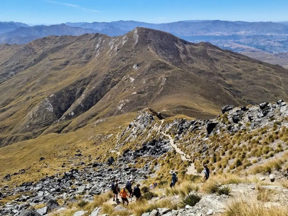 A group of hikers on the Ben Lomond Saddle - a free hiking trail in Queenstown if you do the Tiki Trail instead of the Skyline Gondola