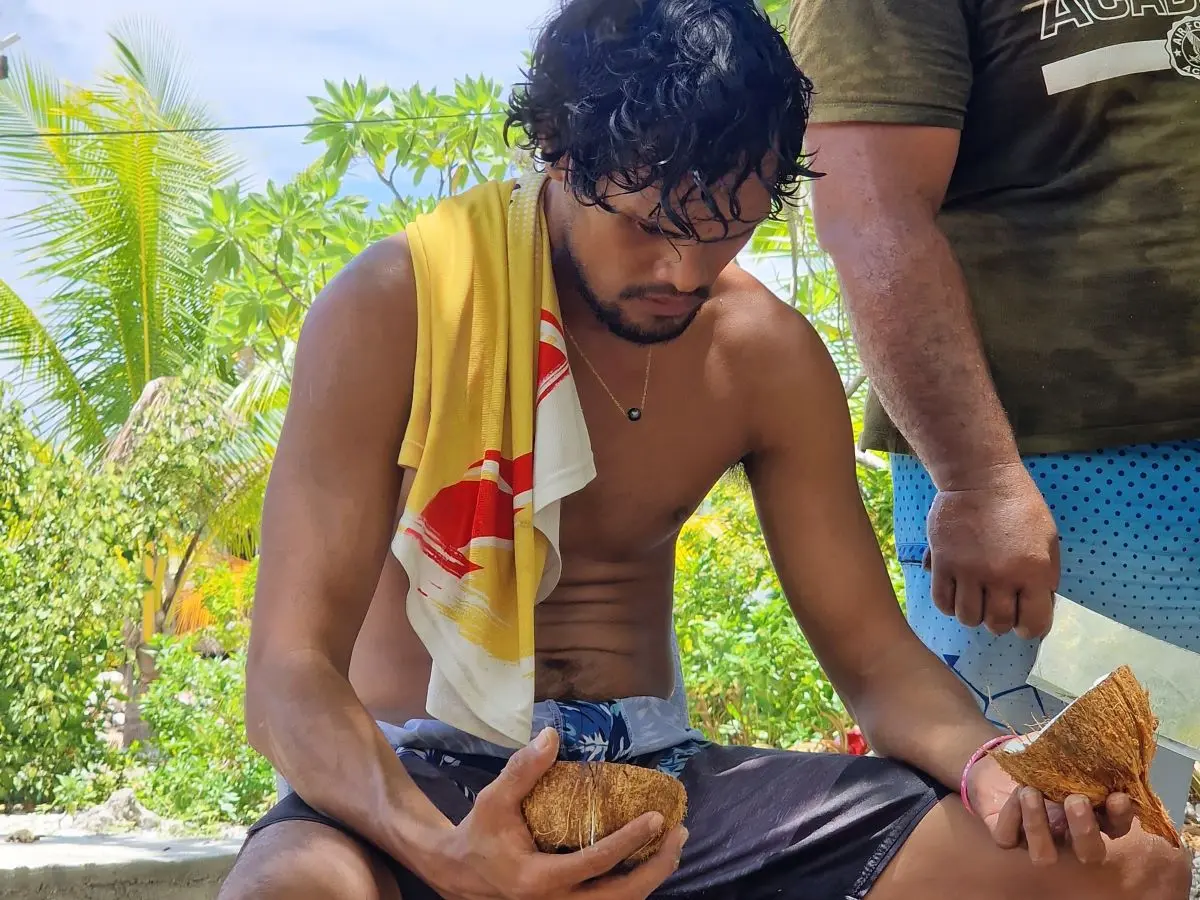 Rainui makes some of his money from processing coconut