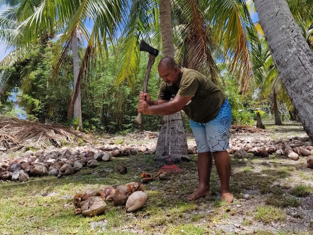 Uncle Dave, one of Rainui's friends, holds the record for breaking most coconuts the fastest